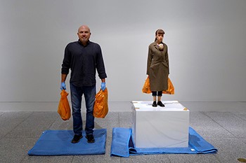 Dale Benson strikes a pose with Woman with Shopping.