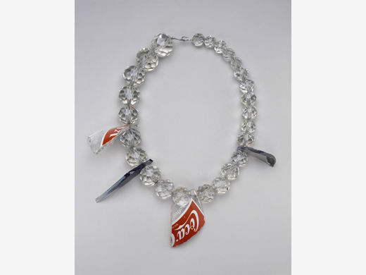Bernhard Schobinger, Shards from Moritzplatz Berlin Necklace, 1983–84, antique crystal beads, television bulbs, German Coca-Cola bottle, silver, and steel wire, the Museum of Fine Arts, Houston, Helen Williams Drutt Collection, museum purchase funded by Gail and Louis K. Adler in honor of Fayez Sarofim. © Bernhard Schobinger; photo: Thomas R. DuBrock