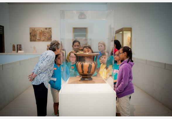 School group and docent with Greek art